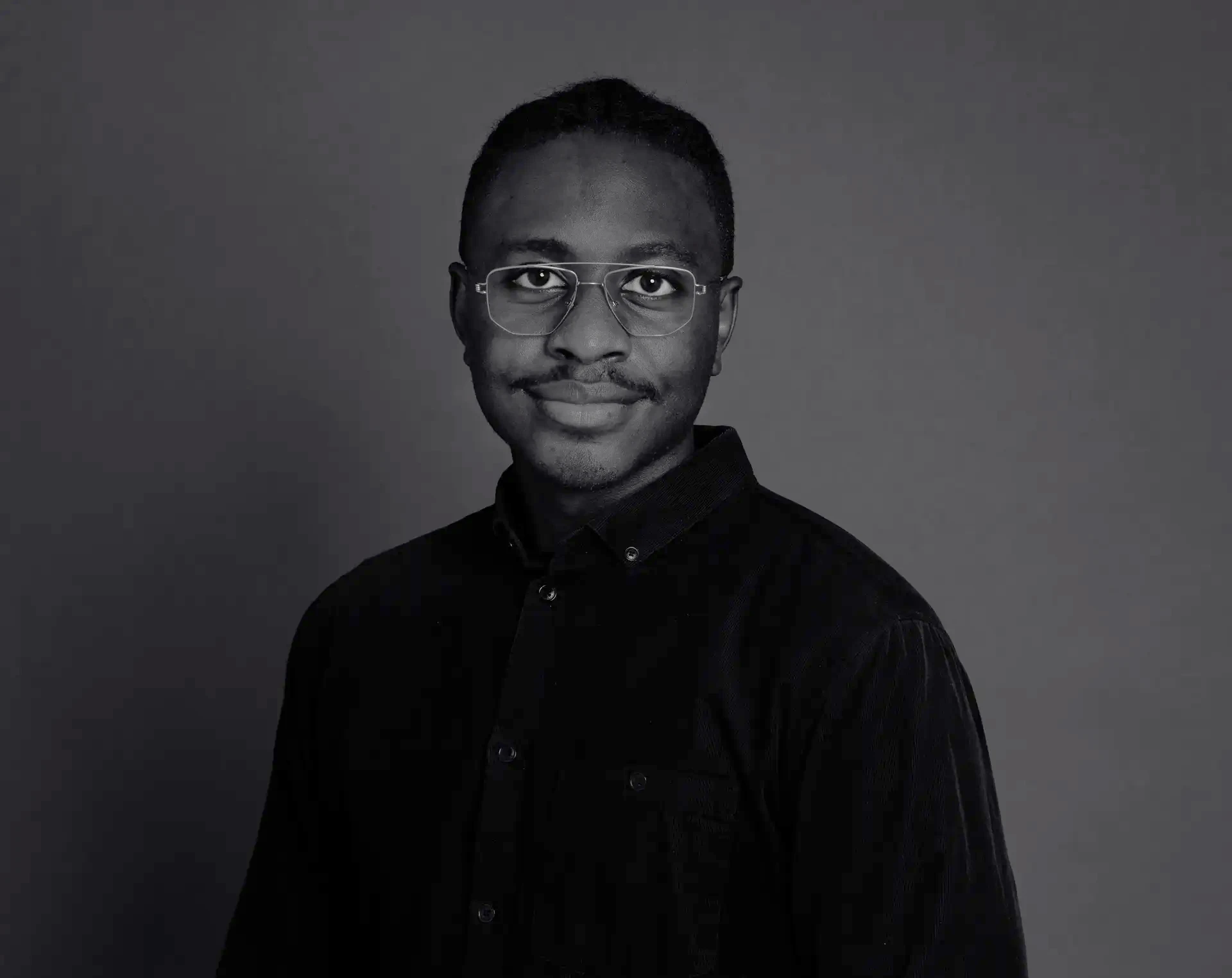 Portrett av Gustave Kamanzi, arkitekt og BIM Manager.