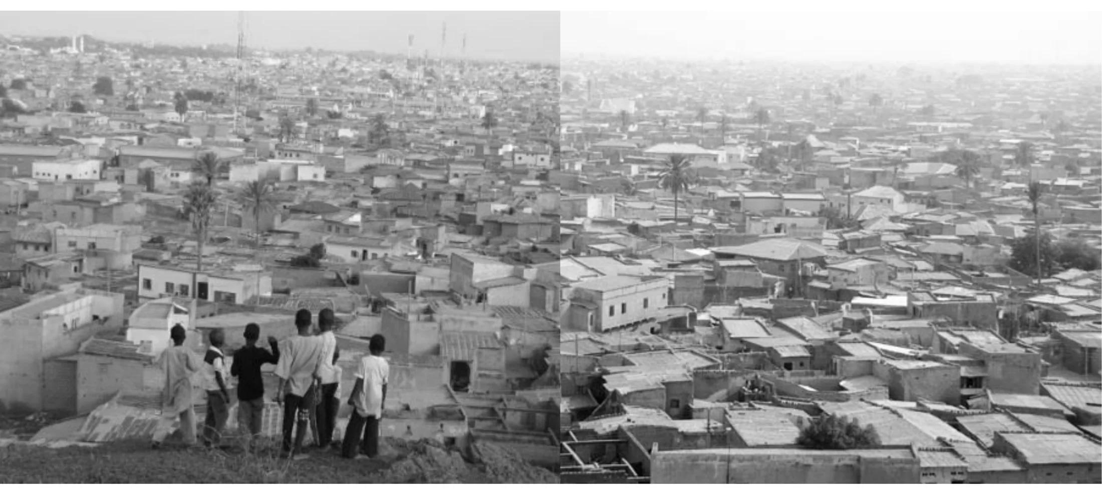 Presentasjonsplansje: Katsina sett over hustakene, med byen som strekker seg mot horisonten.